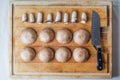 MushroomÃ¢â¬â¢s caps and stipes in order with knife Royalty Free Stock Photo